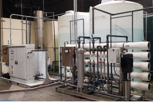 Industrial equipment with tanks and piping systems.