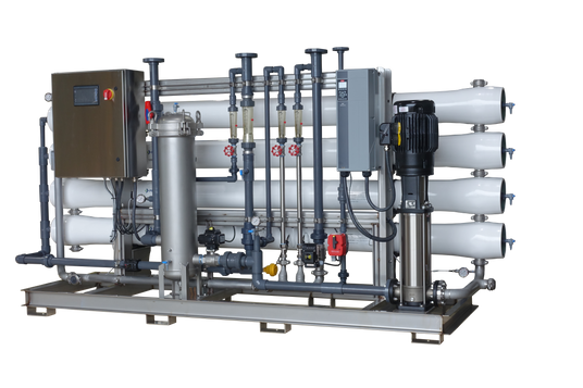 Industrial water filtration system with multiple cartridges and control panel.