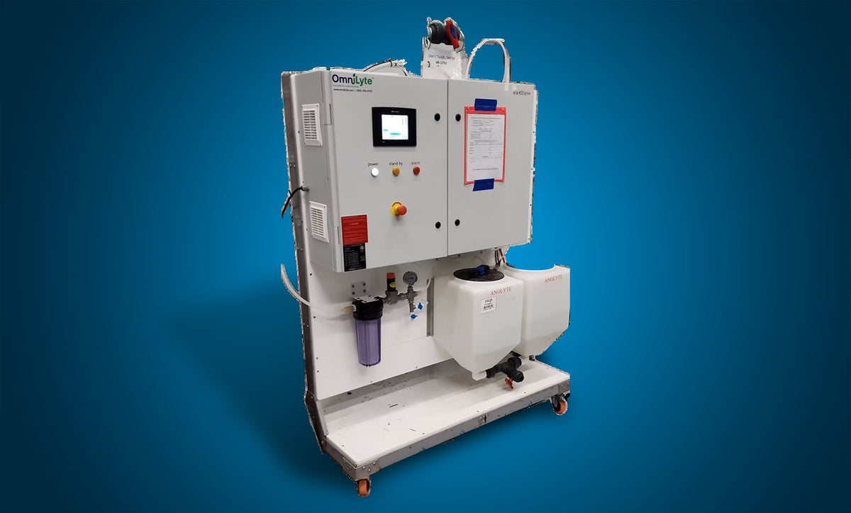 OmniLyte equipment with control panel and fluid containers, on a wheeled base.