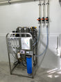 Water filtration system with multiple filters and control panel.