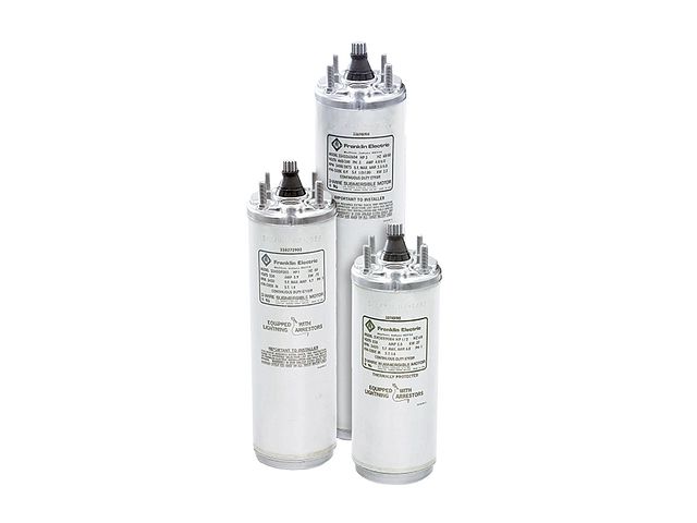 Three cylindrical electric capacitors with metal casings and labels.