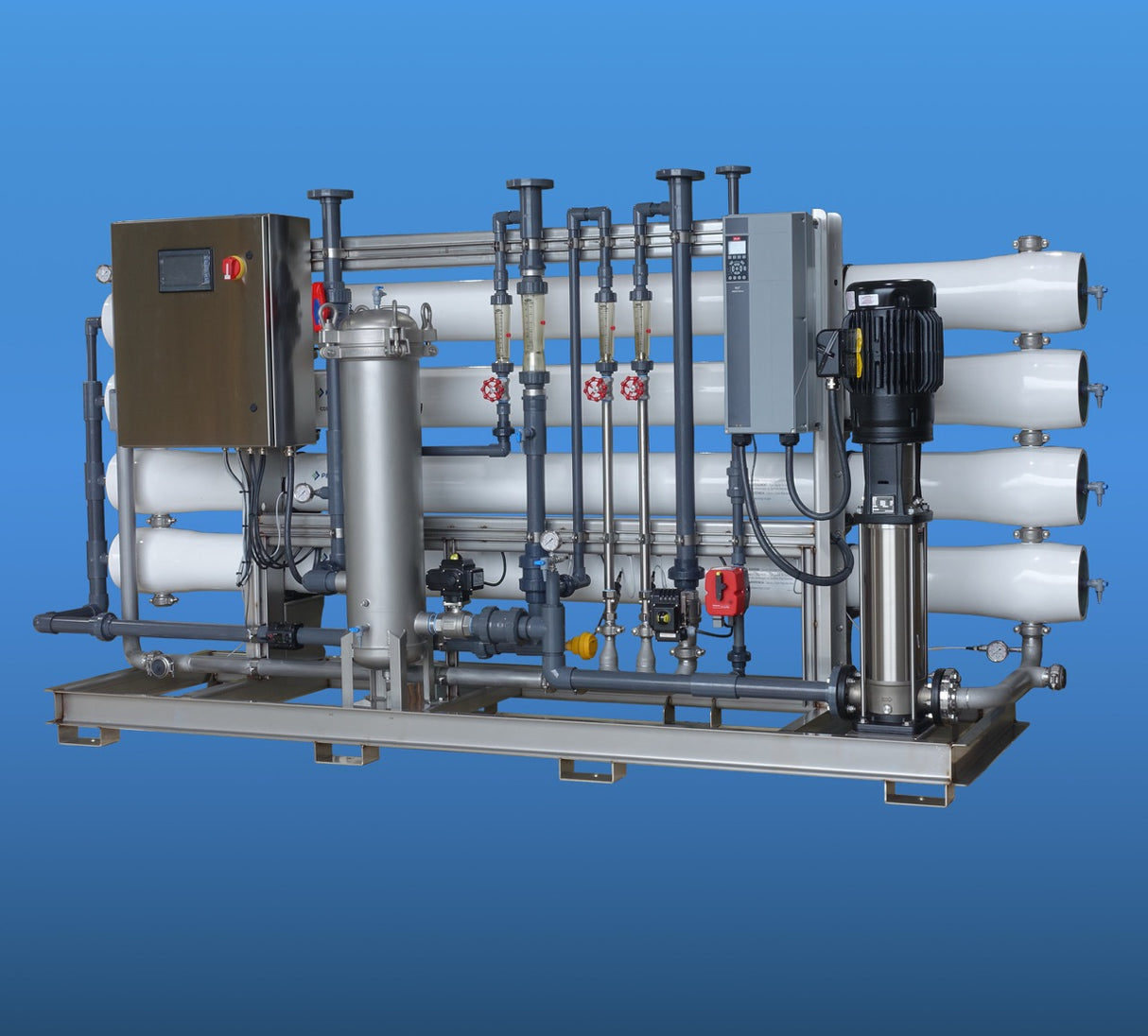 Industrial water treatment system with pipes, valves, and a control panel.