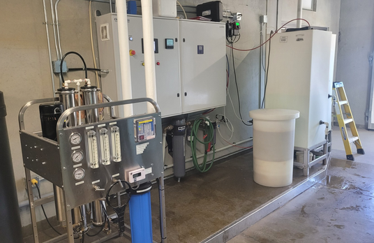 Industrial equipment and machinery in a facility, including filters, tanks, and control panels.