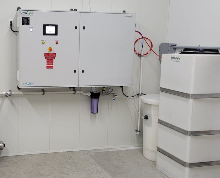 Control panel and water tank in an industrial setting.