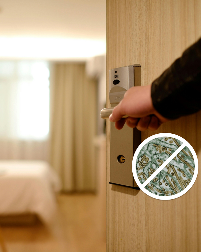 Hand reaching for a hotel room door handle with an inset showing a microscope image of germs.