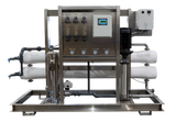 Water filtration system with stainless steel frame and multiple pressure gauges.