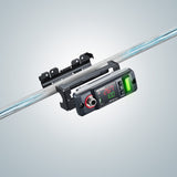 Digital display device mounted on a metal rod, showing measurements and indicators.