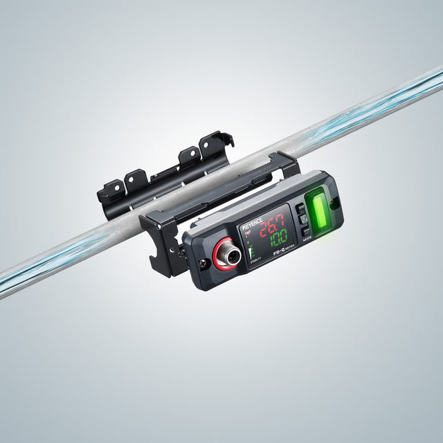 Digital display device mounted on a metal rod, showing measurements and indicators.
