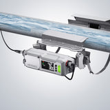 KEYENCE device mounted on a metal pipe, displaying measurements.