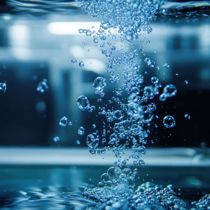 Bubbles rising in water, creating a dynamic underwater scene.
